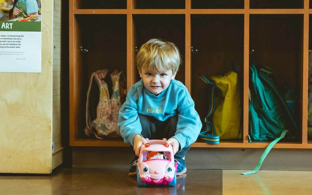 Boy playing with a toy car at the Early Learning Center